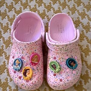 Kids Pink splatter Crocs with Princess gibbets
